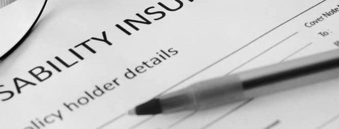 Pen and glasses resting on insurance form