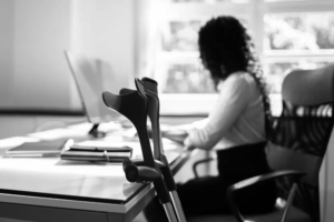 injured employee sitting at a desk filing a workers' compensation claim