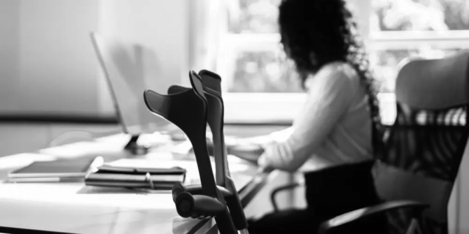 injured employee sitting at a desk filing a workers' compensation claim